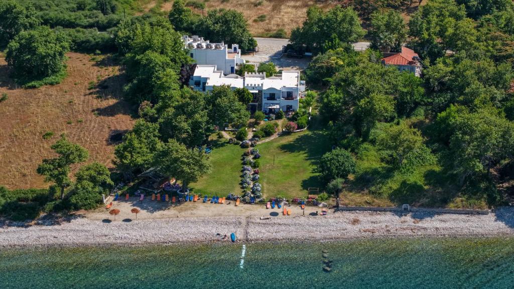 an aerial view of a house on a island in the water at Archondissa Beach Aparthotel in Therma