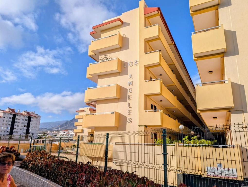 a building with balconies on the side of it at Los Cristianos Sun and Relax in Tenerife