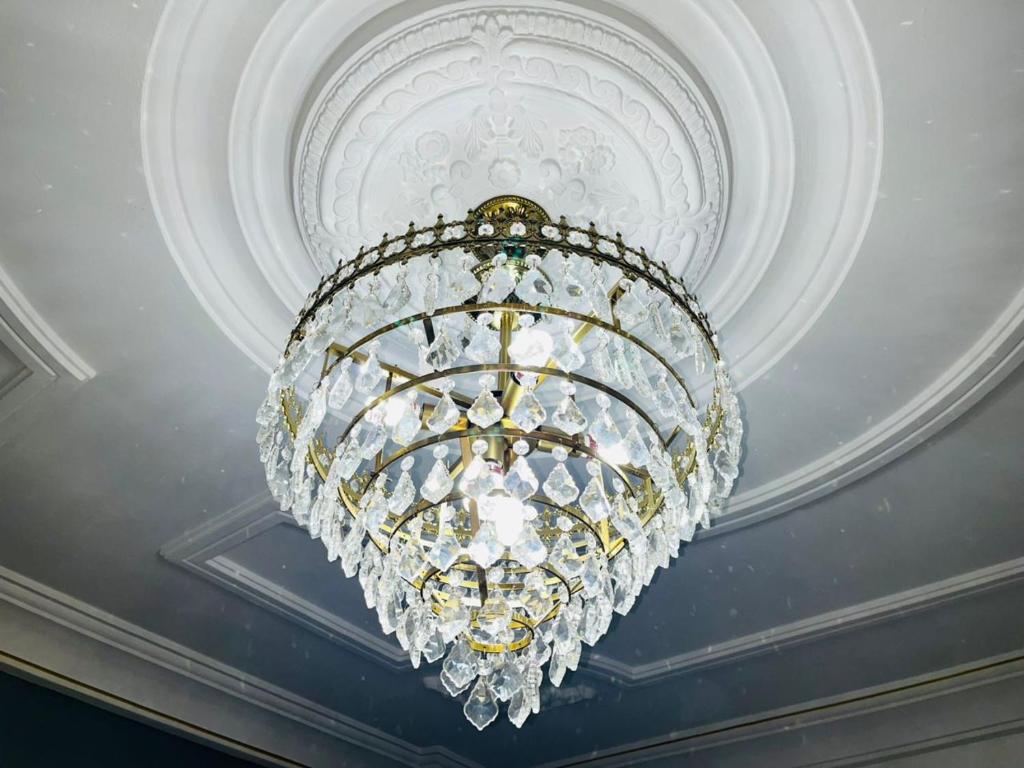a chandelier hanging from a ceiling at GodIsGood Residency in Yaoundé