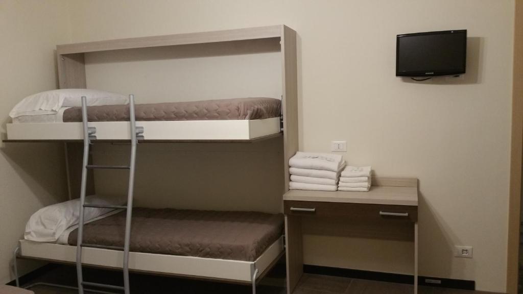 Postel nebo postele na pokoji v ubytování Hotel Tommaseo