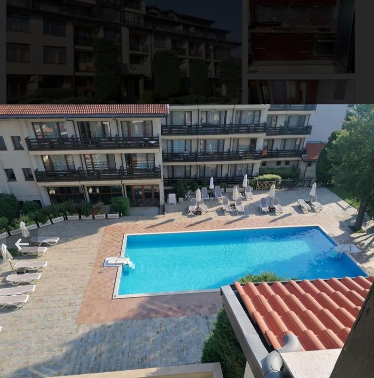 a swimming pool in front of a building at apartment Marina hill in Chernomorets