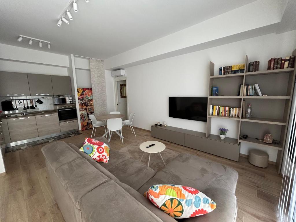 a living room with a couch and a table at BeB Loft Corigliano Rossano CS in Rossano Stazione