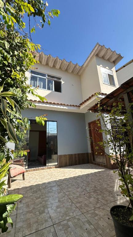 a house with a patio in front of it at Quarto de vila na Urca in Rio de Janeiro