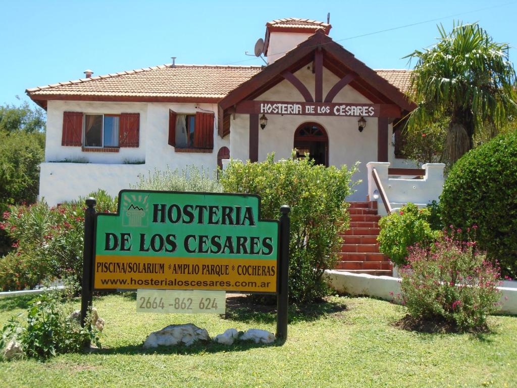 a house with a sign in front of it at Hostería de los Césares in Merlo