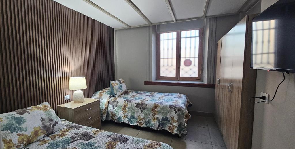 Postel nebo postele na pokoji v ubytování Hostal Paso por La Serena