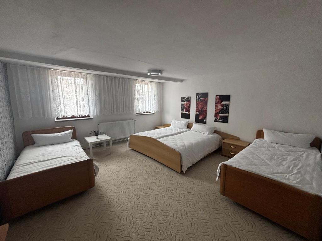 Ένα ή περισσότερα κρεβάτια σε δωμάτιο στο Ferienhaus Iridam