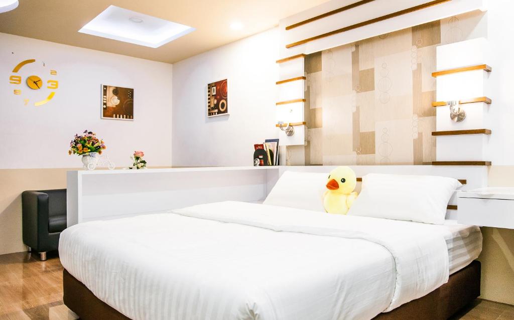 Postel nebo postele na pokoji v ubytování Sunset Residence Pinklao