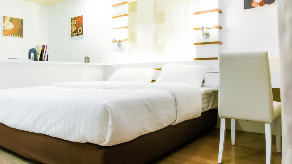 Postel nebo postele na pokoji v ubytování Sunset Residence Pinklao