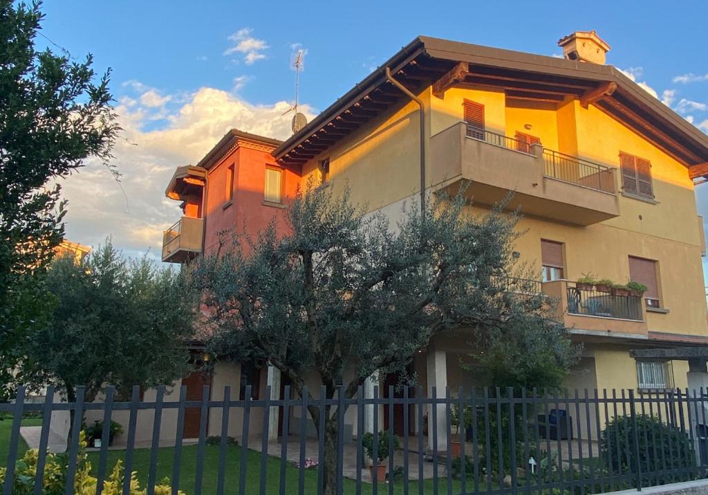 a building with a fence in front of it at Villa Mattei Franciacorta in Villa Pedergnano
