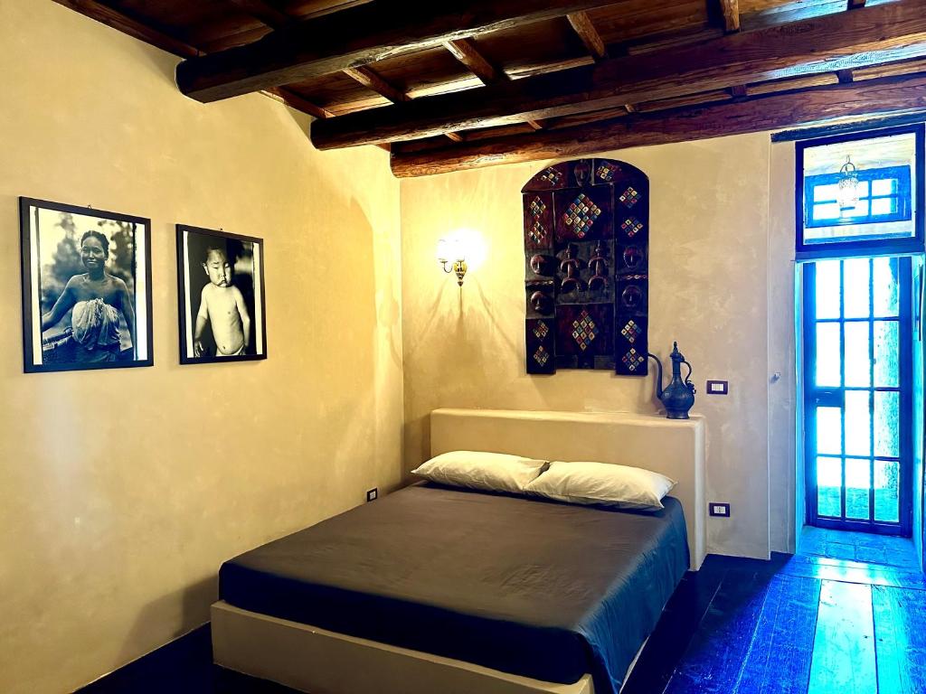 Postel nebo postele na pokoji v ubytování Casa del Viaggiator Cortese