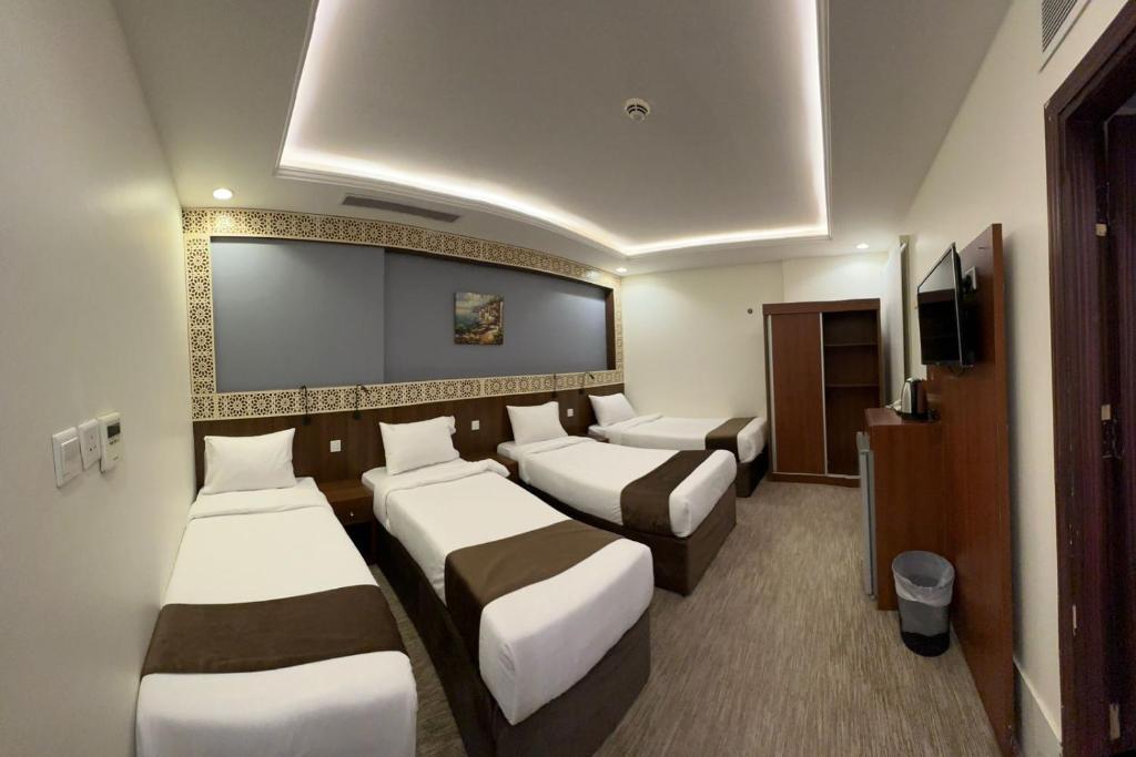 Un ou plusieurs lits dans un hébergement de l'établissement فندق برايت