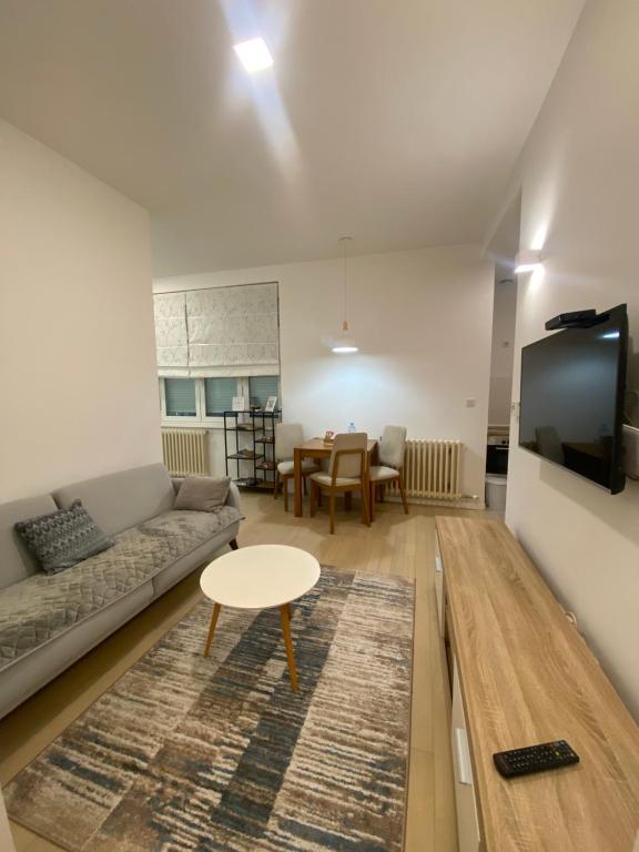 a living room with a couch and a table at BASC Modern 2 in Sarajevo