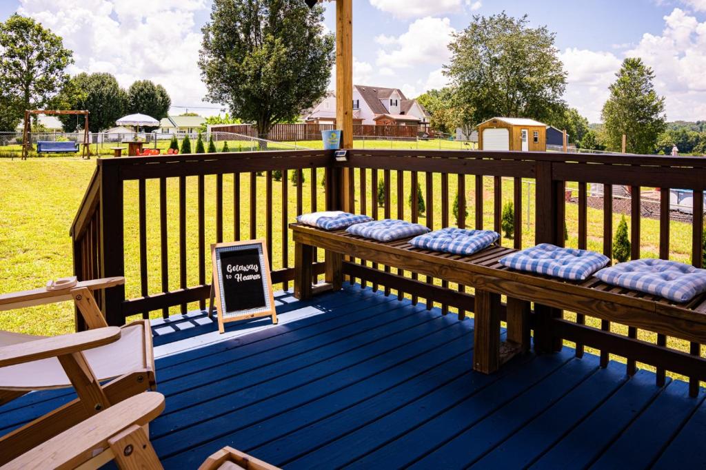 a wooden deck with a bench on top of it at Getaway to heaven in McMinnville