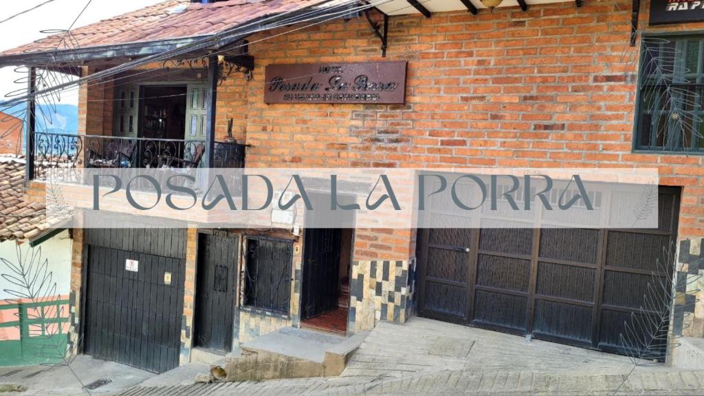 a brick building with a sign that reads pociada portal at Hotel Posada La Porra in Concordia