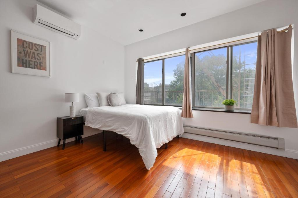 Ένα ή περισσότερα κρεβάτια σε δωμάτιο στο Bowery Two Bedroom