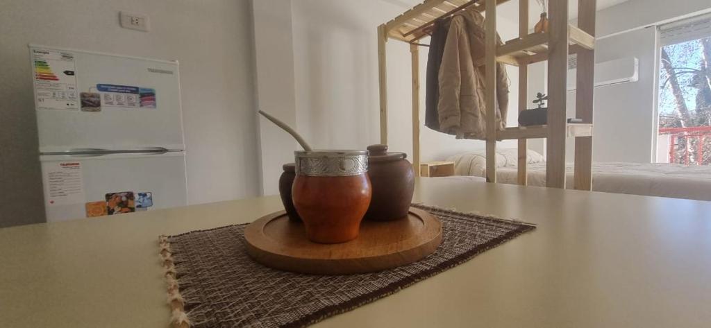 a vase sitting on top of a table at Monoambiente Montevideo in Rosario