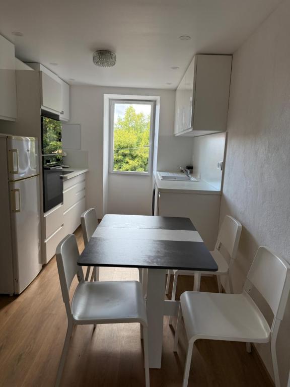 a kitchen with a table and chairs and a kitchen with a window at Casa Tassinca in Tasso