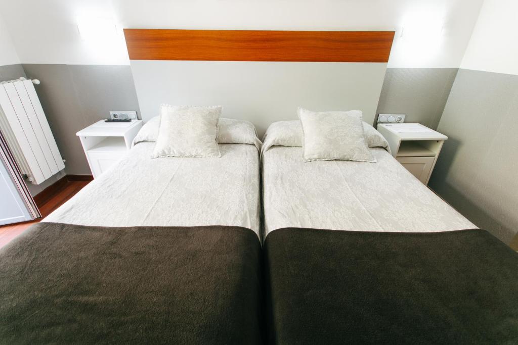Posteľ alebo postele v izbe v ubytovaní Hostal San Ignacio Centro