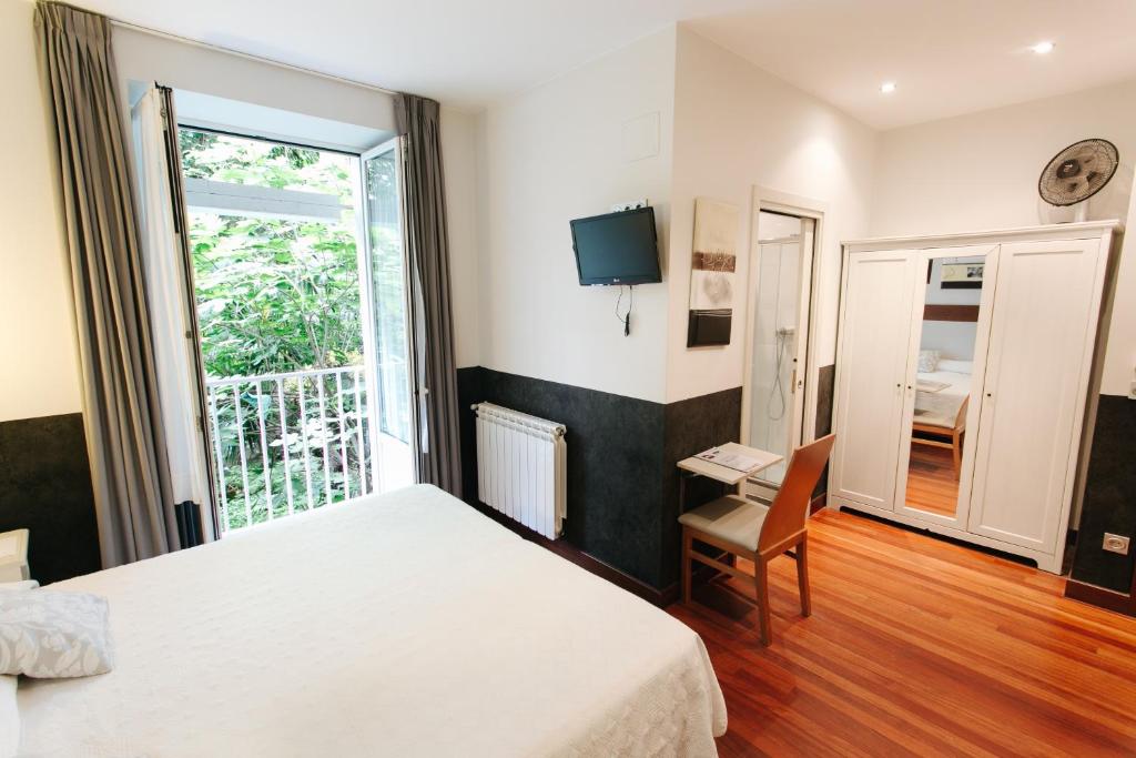 Posteľ alebo postele v izbe v ubytovaní Hostal San Sebastian Centro