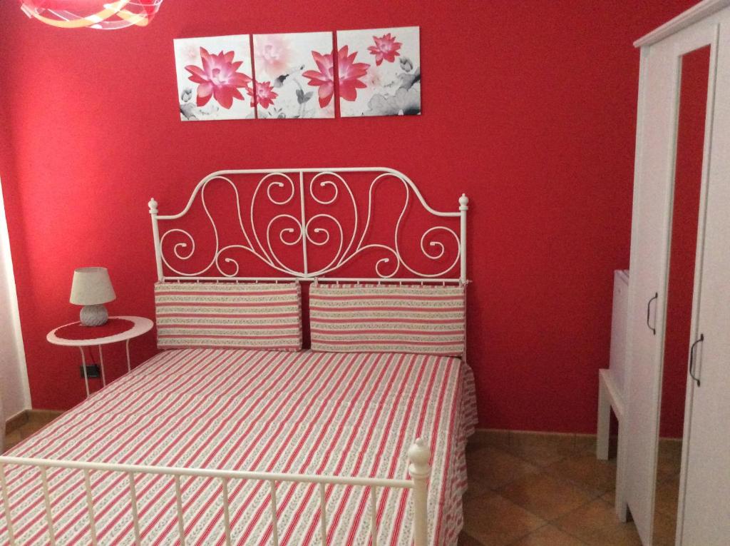 Letto o letti in una camera di B&B in Residence "...a due passi dalla Scala dei Turchi"