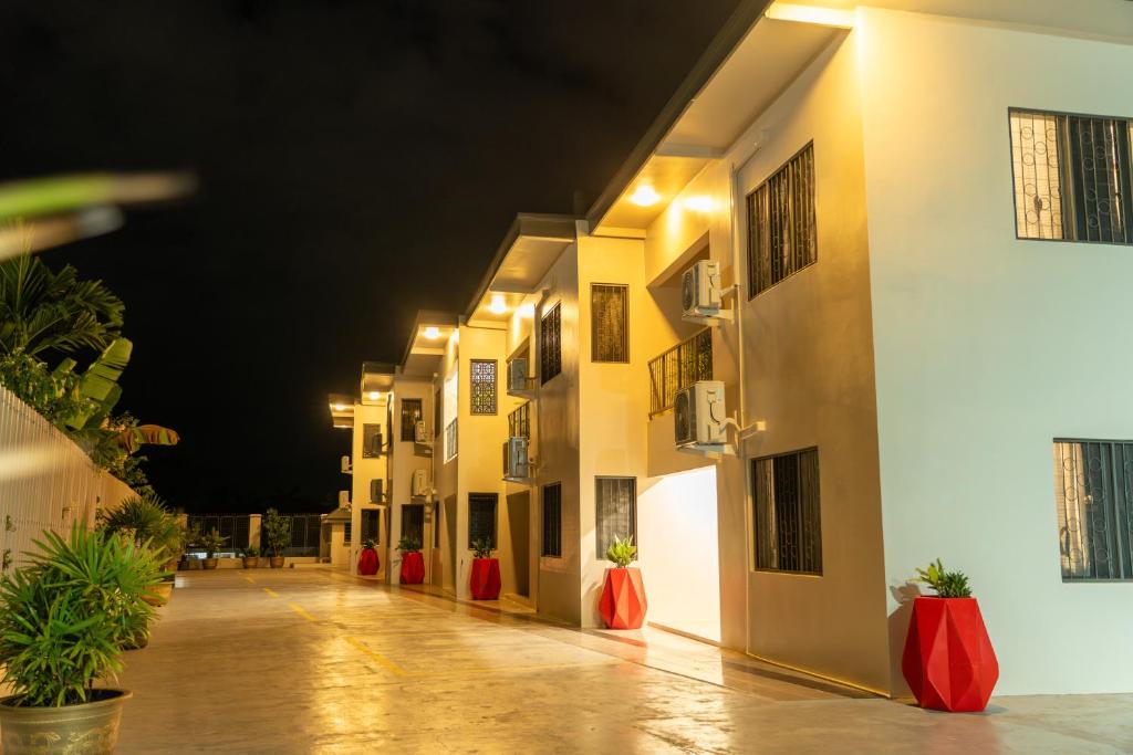 an empty courtyard of a hotel at night at Airport Ace Villas in Nadi
