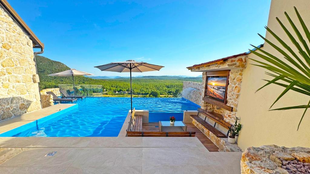 Πισίνα στο ή κοντά στο Sunset Stone Villa