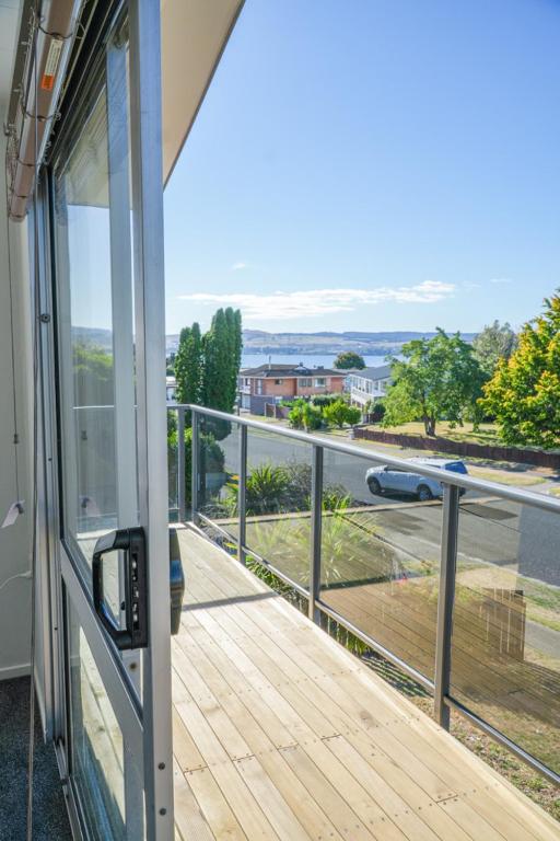 a balcony of a house with a view of a street at Richmond Heights apartment in Taupo