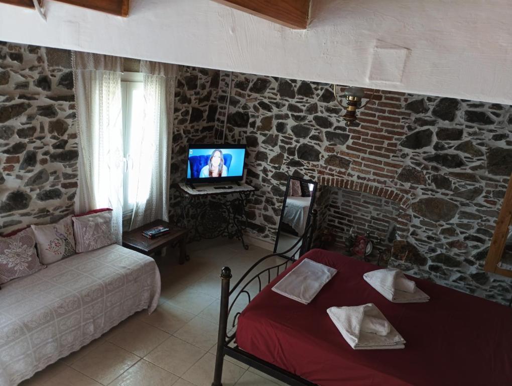 Μια τηλεόραση ή/και κέντρο ψυχαγωγίας στο Traditional stone house in Mytilene