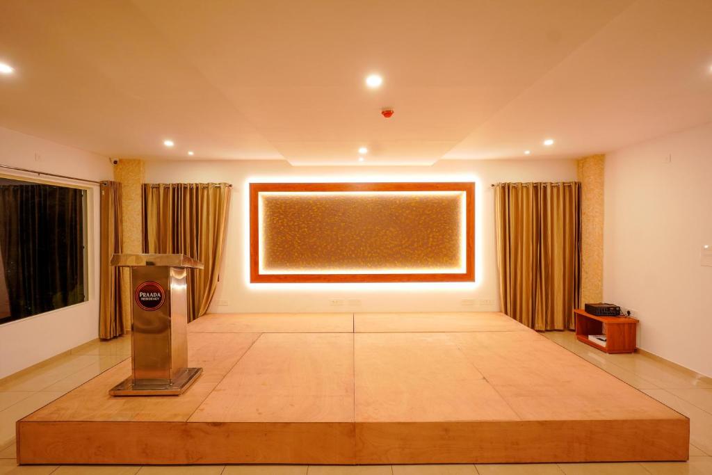 a large room with a large screen in the middle of it at EAGLEi in Kotamangalam