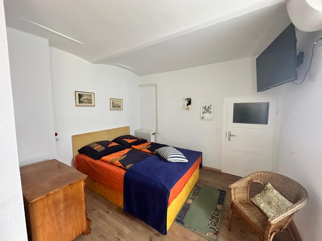 a bedroom with a bed and a table and a chair at Unstruttal in Wangen