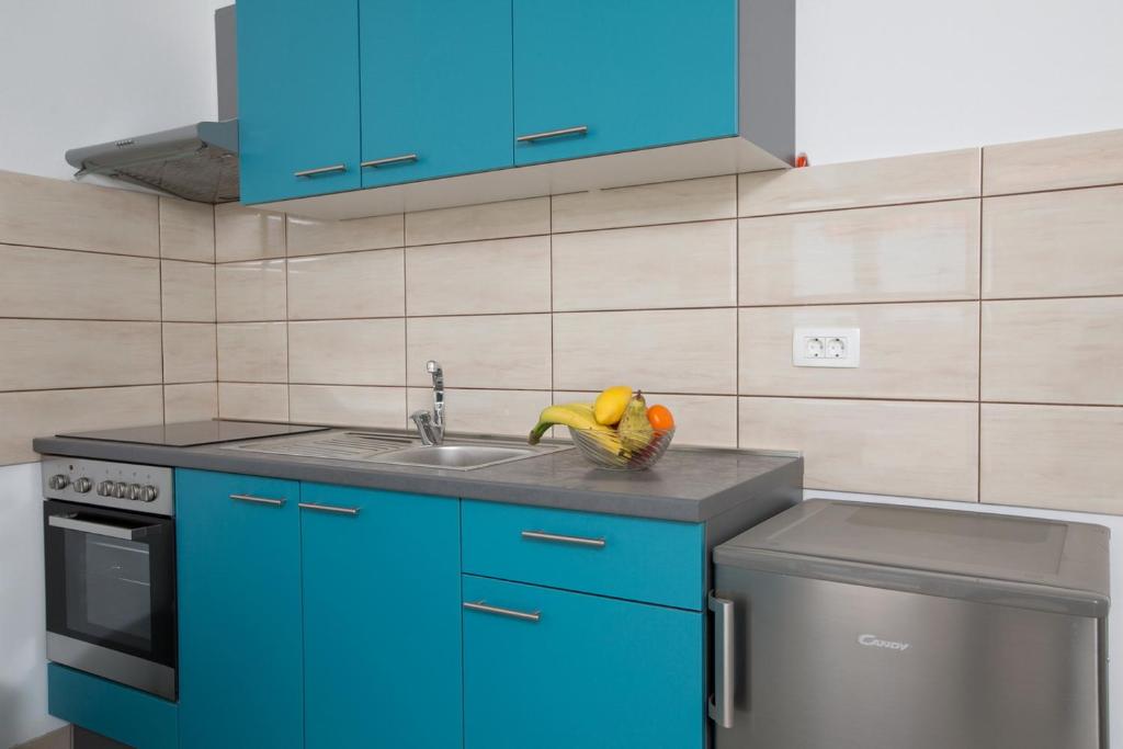 Kuchyňa alebo kuchynka v ubytovaní Apartmani Ve-Ro