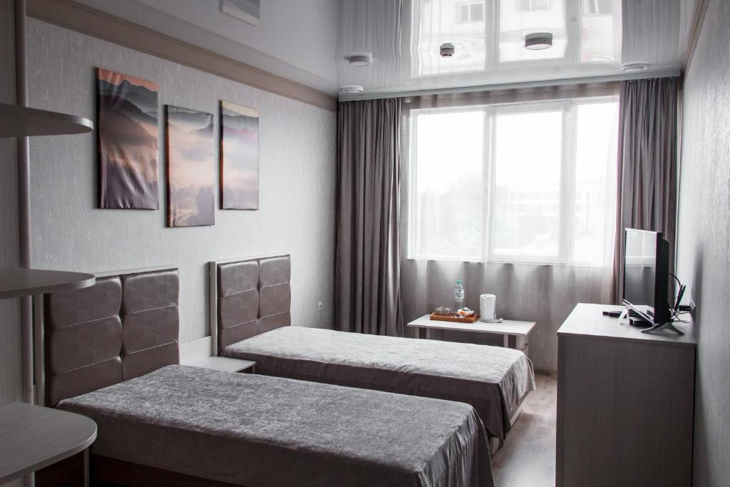 Postel nebo postele na pokoji v ubytování Elite Hotel
