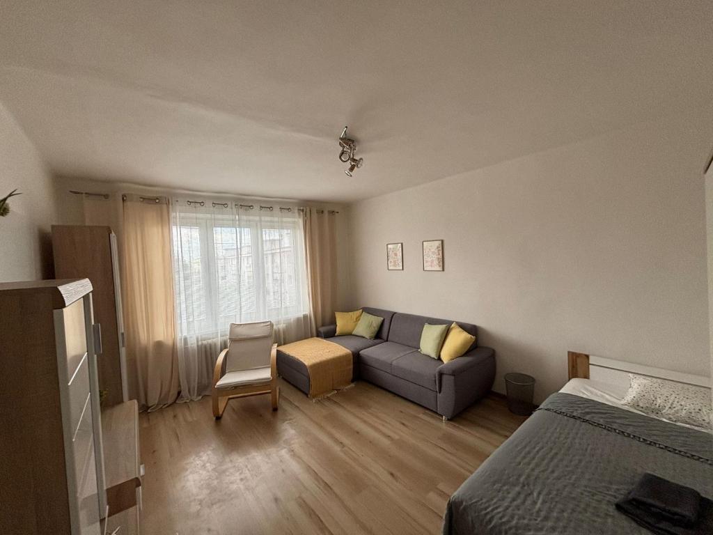 a living room with a couch and a bed at PA - Peaceful Parkside Apartment in KoÅ¡ickÃ© KÃºpele