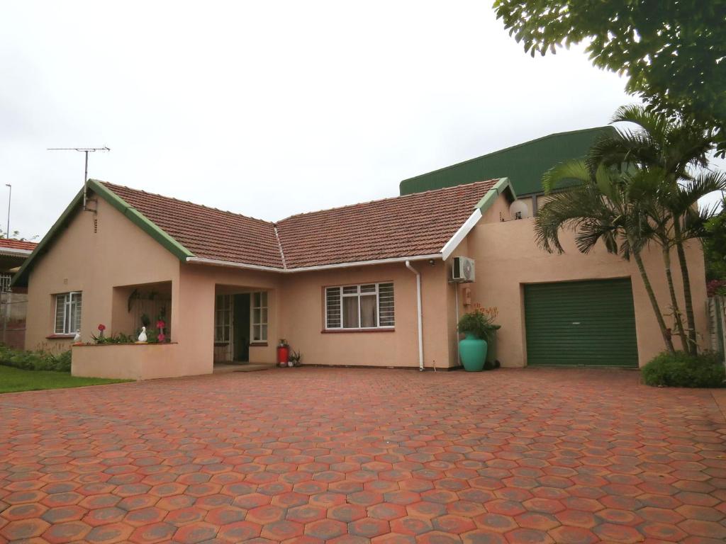 a house with a red brick driveway at JoThams Bed & Breakfast or Self-catering in Durban