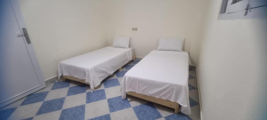 En eller flere senge i et værelse på Gite El Qalaa - مأوى القلعة