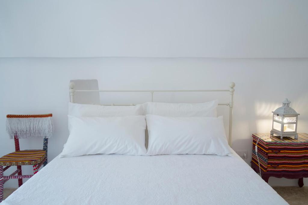 Postel nebo postele na pokoji v ubytování Fikus - the Apulian B&B