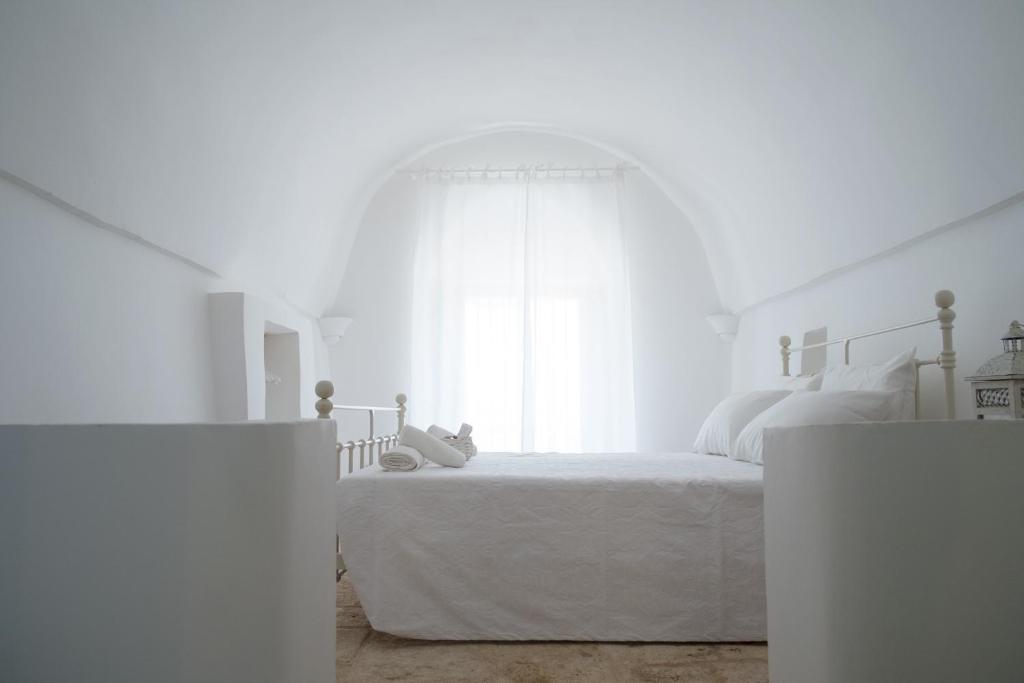 Postel nebo postele na pokoji v ubytování Fikus - the Apulian B&B