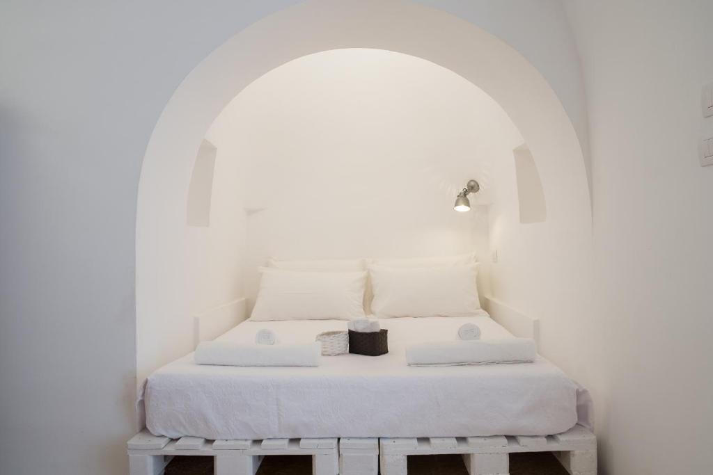Postel nebo postele na pokoji v ubytování Fikus - the Apulian B&B