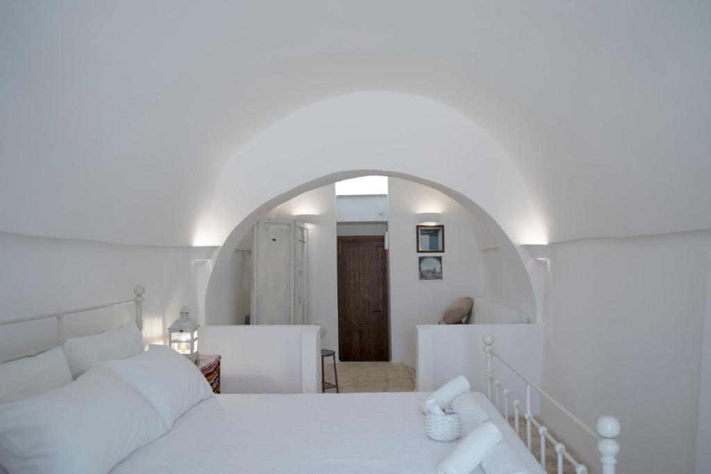 Postel nebo postele na pokoji v ubytování Fikus - the Apulian B&B