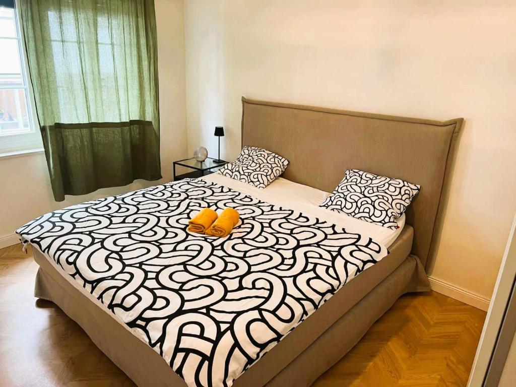 a bedroom with a bed with a pumpkin on it at Spacious Old Town Flat, Munster in Zürich