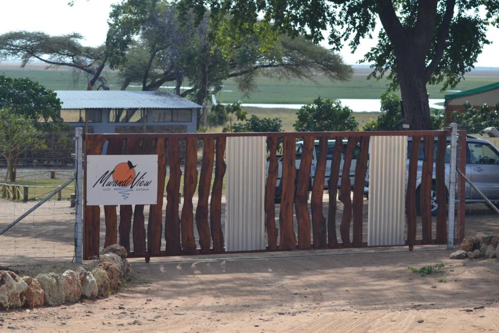 a wooden gate with a sign on it at Mwandi View in Kavimba