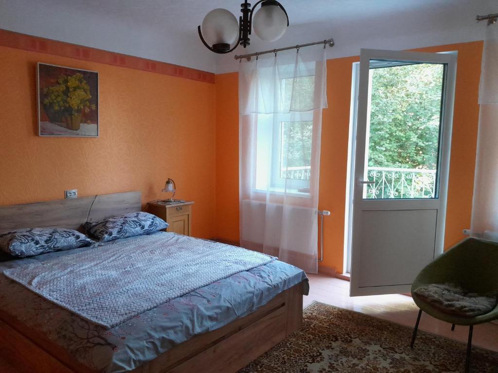 a bedroom with a bed and a window and a door at Dubavi 