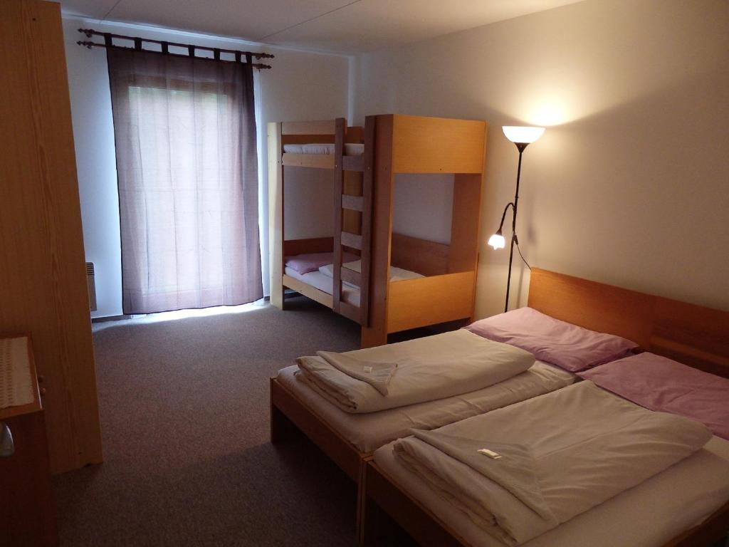 Postel nebo postele na pokoji v ubytování Chaty Kotárky