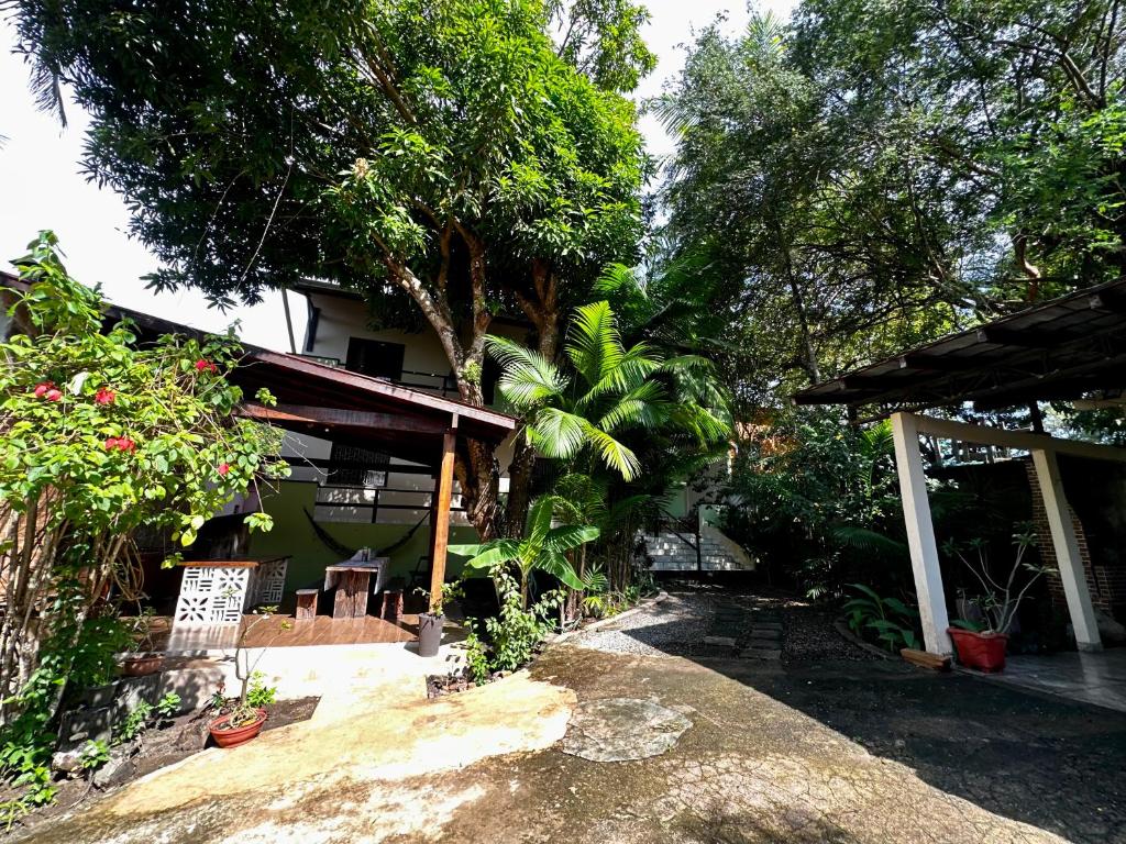 a house with a table and chairs in front of it at Casa em Alter do chão - lago verde in Alter do Chao