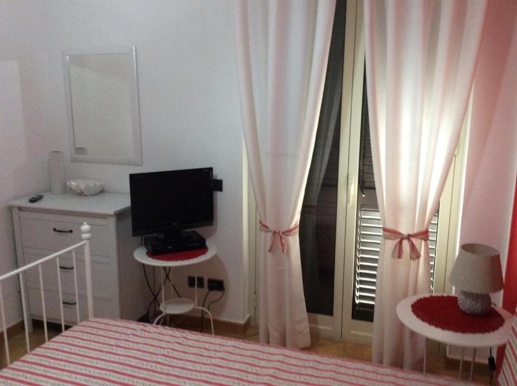 Letto o letti in una camera di B&B in Residence "...a due passi dalla Scala dei Turchi"