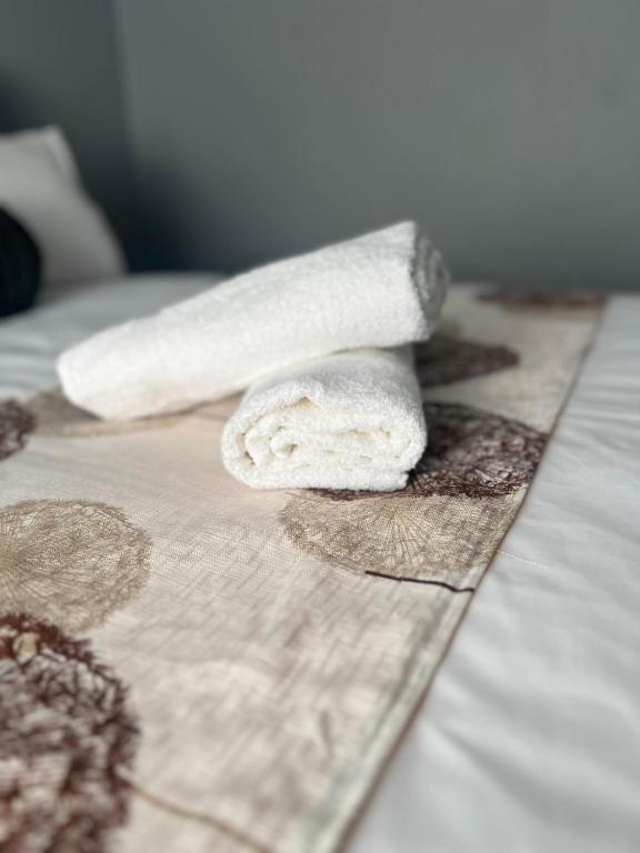 Postel nebo postele na pokoji v ubytování iNala Urban Guesthouse