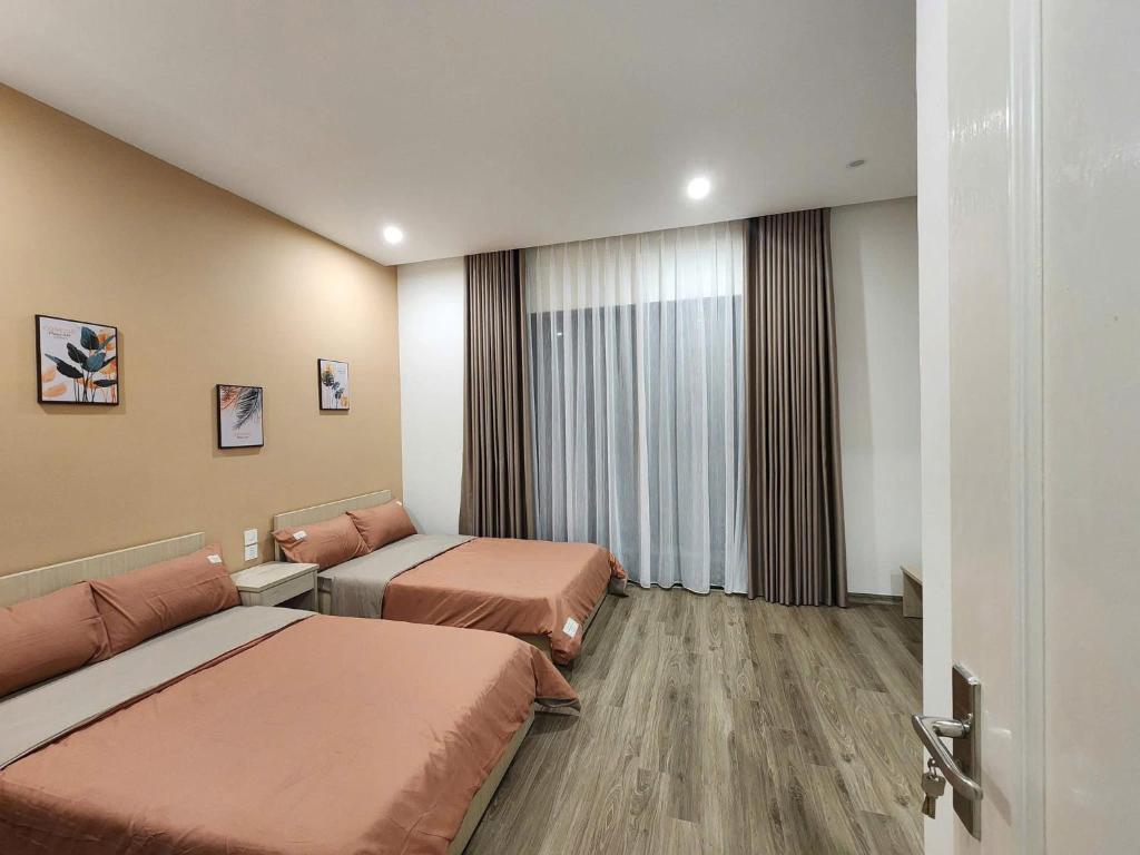 Postel nebo postele na pokoji v ubytování SH14-55, Vinhome Ocean Park 2