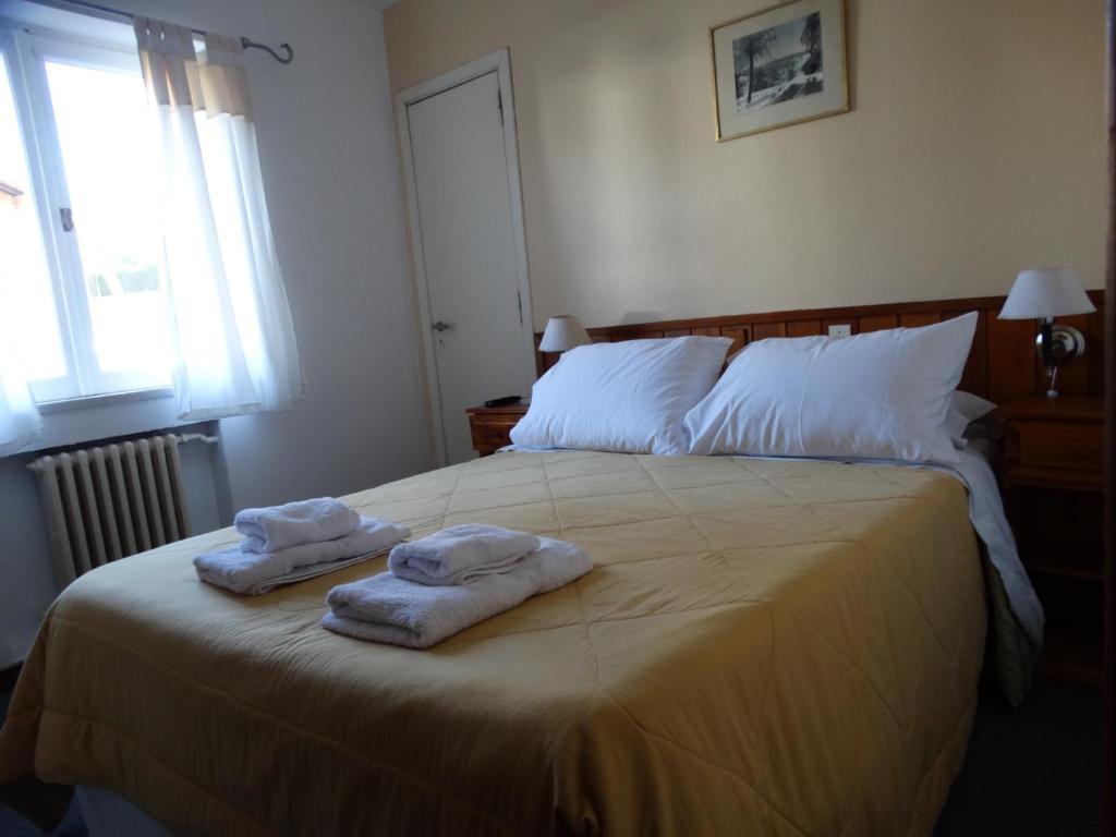 Postel nebo postele na pokoji v ubytování Hosteria La Pastorella