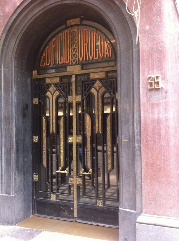 Hotel Beautiful, down-town, an entrance to a store with a wrought iron door at Beautiful, down-town in Mexico City