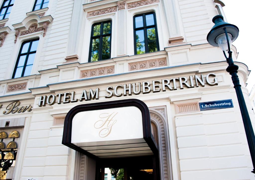 a hotel am collaborating sign on the front of a building at Hotel Am Schubertring in Vienna